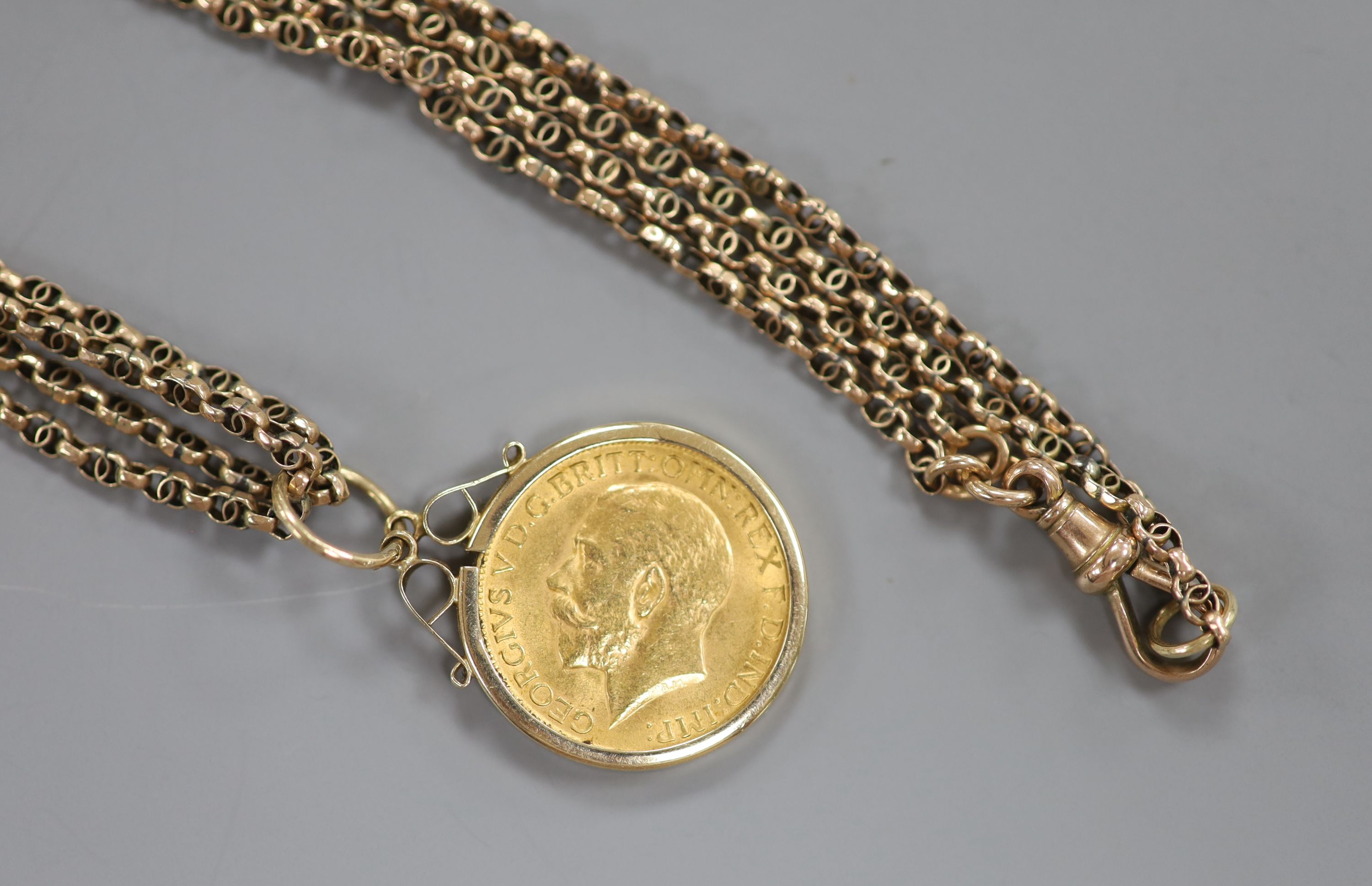 A George V 1912 gold sovereign, in 9ct gold pendant mount, on an Edwardian 9c double link chain, 79cm, gross 26.1 grams.